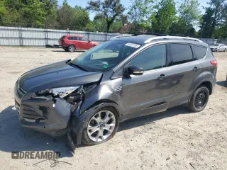 2015 Ford Escape Titanium with VIN 1FMCU9J92FUC74879, listed as a Copart auction lot 54683185 with 143,436 mi miles and Salvage title. Bid and sale history available at DreamBid. Image 1.