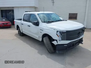2023 Ford F-150 Lightning Pro with VIN 1FTVW1EL2PWG18764, listed as a IAAI auction lot 41908278 with 16,276 mi miles and . Bid and sale history available at DreamBid. Image 1.