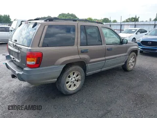 2001 Jeep Grand Cherokee Laredo z VIN 1J4GX48N51C548958, wystawiony jako IAAI lot #42460303 z przebiegiem 210 379 mil mil oraz . Historia ofert i sprzedaży dostępna na DreamBid. Obrazek 4.