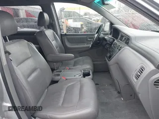 2004 Honda Odyssey EX-L with VIN 5FNRL18934B016420, listed as a IAAI auction lot 41473237 with 188,659 mi miles and . Bid and sale history available at DreamBid. Image 5.