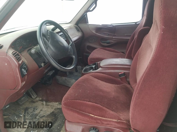1998 Ford F-150 XL with VIN 2FTRX08L2WCA75995, listed as a Copart auction lot 43717305 with 301,987 mi miles and Salvage title. Bid and sale history available at DreamBid. Image 7.