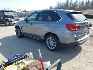 2015 BMW X5 xDrive35i with VIN 5UXKR0C53F0K60910, listed as a IAAI auction lot 41857733 with 153,583 mi miles. Bid and sale history available at carsss.com. Image 3.