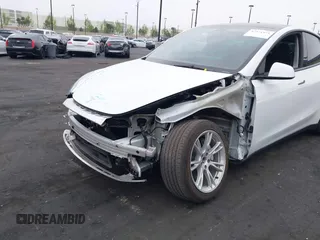 2023 Tesla Model Y Long Range z VIN 7SAYGDEE5PA063097, wystawiony jako IAAI lot #42171871 z przebiegiem Nie podano mil oraz . Historia ofert i sprzedaży dostępna na DreamBid. Obrazek 6.