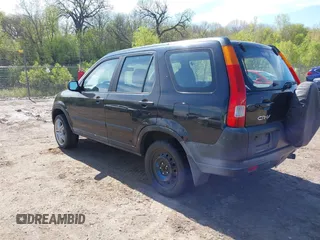 2002 Honda CR-V LX with VIN JHLRD68402C018458, listed as a IAAI auction lot 42206935 with 212,229 mi miles and . Bid and sale history available at carsss.com. Image 3.