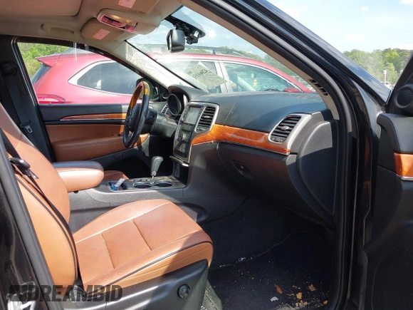 2013 Jeep Grand Cherokee Overland with VIN 1C4RJECT3DC526005, listed as a IAAI auction lot 42064151 with 112,777 mi miles and . Bid and sale history available at DreamBid. Image 5.