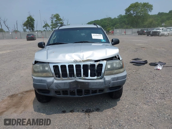 2002 Jeep Grand Cherokee Laredo with VIN 1J4GW48SX2C313093, listed as a IAAI auction lot 42446559 with 200,319 mi miles and . Bid and sale history available at DreamBid. Image 12.