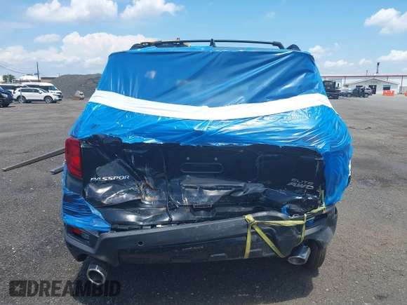 2023 Honda Passport Elite with VIN 5FNYF8H01PB030270, listed as a IAAI auction lot 42667744 with 7,931 mi miles and . Bid and sale history available at DreamBid. Image 16.