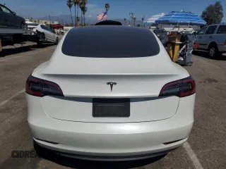 2023 Tesla Model 3 with VIN 5YJ3E1EA8PF394705, listed as a Copart auction lot 52319945 with 58,193 mi miles and Salvage title. Bid and sale history available at DreamBid. Image 6.