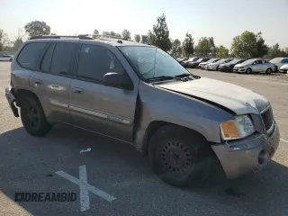 2005 GMC Envoy SLT with VIN 1GKDS13S952382088, listed as a Copart auction lot 64765154 with 177,333 mi miles and Salvage Title. Bid and sale history available at carsss.com. Image 4.