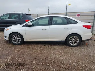 2018 Ford Focus SE z VIN 1FADP3F23JL225333, wystawiony jako IAAI lot #41758445 z przebiegiem 133 307 mil mil oraz . Historia ofert i sprzedaży dostępna na DreamBid. Obrazek 14.