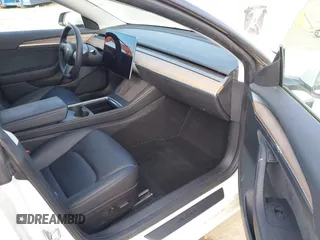 2022 Tesla Model 3 with VIN 5YJ3E1EA1NF167711, listed as a IAAI auction lot 41594266 with 50,554 mi miles and . Bid and sale history available at DreamBid. Image 5.