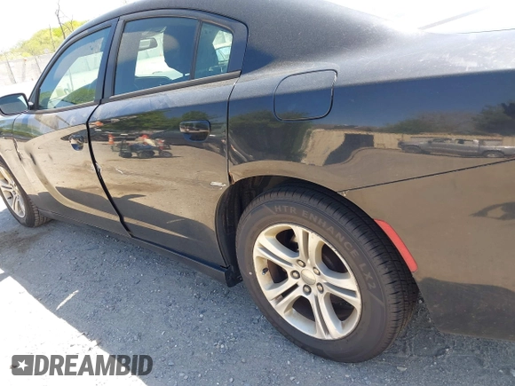2015 Dodge Charger SE with VIN 2C3CDXBG9FH790573, listed as a IAAI auction lot 42142908 with 195,182 mi miles and . Bid and sale history available at carsss.com. Image 17.