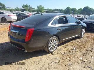 2014 Cadillac XTS Luxury z VIN 2G61M5S30E9229758, wystawiony jako IAAI lot #42179952 z przebiegiem 125 848 mil mil oraz . Historia ofert i sprzedaży dostępna na DreamBid. Obrazek 4.
