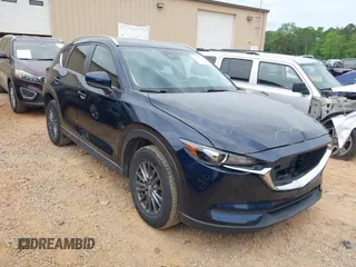 2020 Mazda CX-5 Touring with VIN JM3KFBCM9L0741535, listed as a IAAI auction lot 42101763 with 54,004 mi miles and . Bid and sale history available at DreamBid. Image 1.