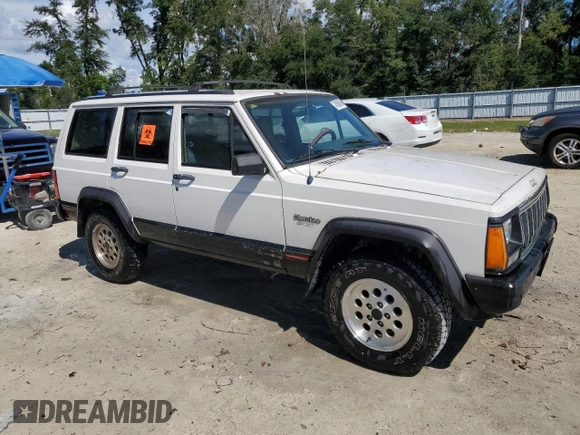 1996 Jeep Cherokee Sport with VIN 1J4FT68S4TL131956, listed as a Copart auction lot 74568064 with 174,014 mi miles and Non Repairable. Bid and sale history available at carsss.com. Image 4.