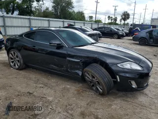 2013 Jaguar XK with VIN SAJWA4FB3DLB50331, listed as a Copart auction lot 66573384 with 109,887 mi miles and Salvage Title. Bid and sale history available at carsss.com. Image 4.