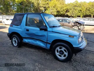 1995 Geo Tracker z VIN 2CNBE18U4S6948656, wystawiony jako Copart lot #76087194 z przebiegiem 163 080 mil mil oraz Szkody całkowita. Historia ofert i sprzedaży dostępna na DreamBid. Obrazek 4.