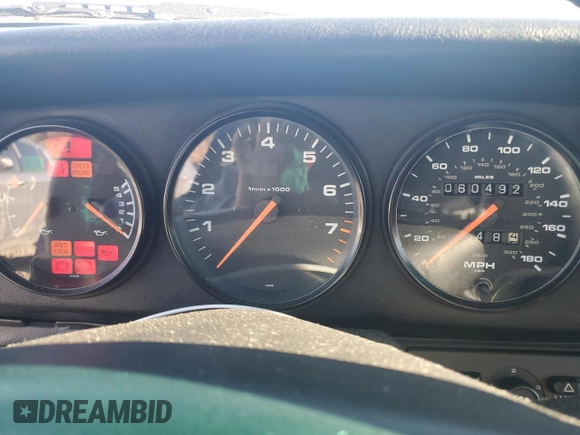 1996 Porsche 911 with VIN WP0DA2996TS385231, listed as a Copart auction lot 83699964 with 60,492 mi miles and Salvage title. Bid and sale history available at DreamBid. Image 9.