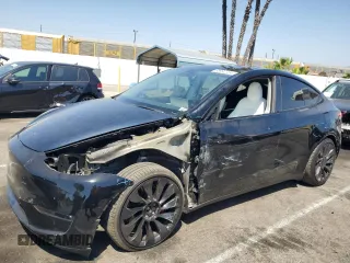 2022 Tesla Model Y Performance z VIN 7SAYGDEF4NF436834, wystawiony jako Copart lot #68992234 z przebiegiem 22 171 mil mil oraz Szkoda całkowita • Salvage title. Historia ofert i sprzedaży dostępna na DreamBid. Obrazek 1.