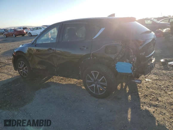 2018 Mazda CX-5 Grand Touring with VIN JM3KFBDMXJ0318474, listed as a Copart auction lot 46438545 with 58,702 mi miles and Salvage Title. Bid and sale history available at DreamBid. Image 2.