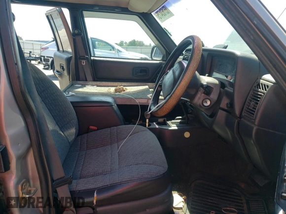 2000 Jeep Cherokee with VIN 1J4FN28S6YL210944, listed as a Copart auction lot 65163475 with 147,609 mi miles and Salvage title. Bid and sale history available at DreamBid. Image 7.