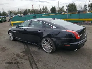 2014 Jaguar XJ Portfolio with VIN SAJWJ2GD4E8V69651, listed as a Copart auction lot 52426195 with 56,413 mi miles and Salvage title. Bid and sale history available at DreamBid. Image 2.