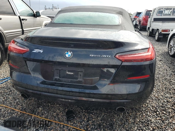 2022 BMW Z4 sDrive30i with VIN WBAHF3C04NWX42062, listed as a Copart auction lot 74989854 with 0 mi miles and Salvage Title. Bid and sale history available at carsss.com. Image 6.