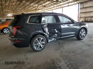 2020 Cadillac XT6 FWD Premium Luxury with VIN 1GYKPCRS8LZ149860, listed as a Copart auction lot 61108985 with 58,459 mi miles and Salvage title. Bid and sale history available at DreamBid. Image 3.
