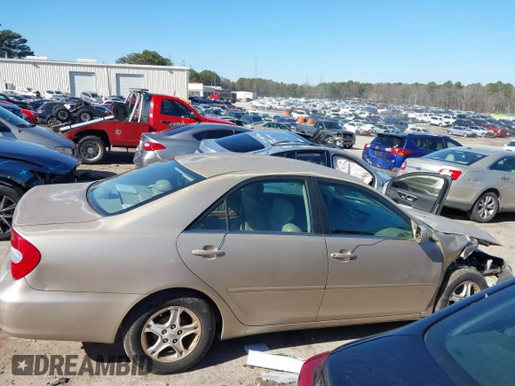 2002 Toyota Camry LE z VIN 4T1BE32K02U051709, wystawiony jako IAAI lot #41485620 z przebiegiem 232 876 mil mil oraz . Historia ofert i sprzedaży dostępna na DreamBid. Obrazek 13.