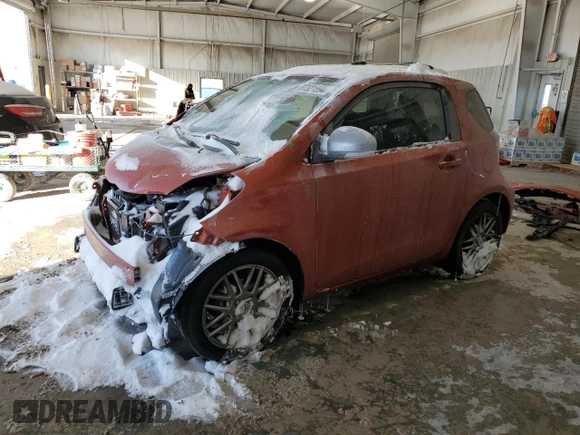 2015 Scion iQ with VIN JTNJJXB09FJ030667, listed as a Copart auction lot 87321594 with 124,895 mi miles and Salvage Title. Bid and sale history available at carsss.com. Image 1.