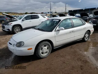 1996 Ford Taurus GL z VIN 1FALP52U7TG263819, wystawiony jako Copart lot #79088104 z przebiegiem 121 073 mil mil oraz Szkoda całkowita • Salvage title. Historia ofert i sprzedaży dostępna na DreamBid. Obrazek 1.