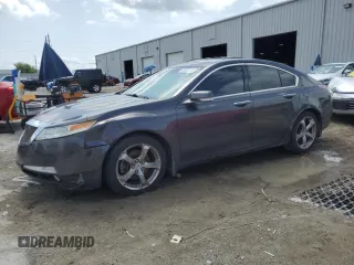 2010 Acura TL Technology z VIN 19UUA8F57AA003569, wystawiony jako Copart lot #59335715 z przebiegiem 152 324 mil mil oraz Czysty tytuł • Clean title. Historia ofert i sprzedaży dostępna na DreamBid. Obrazek 1.