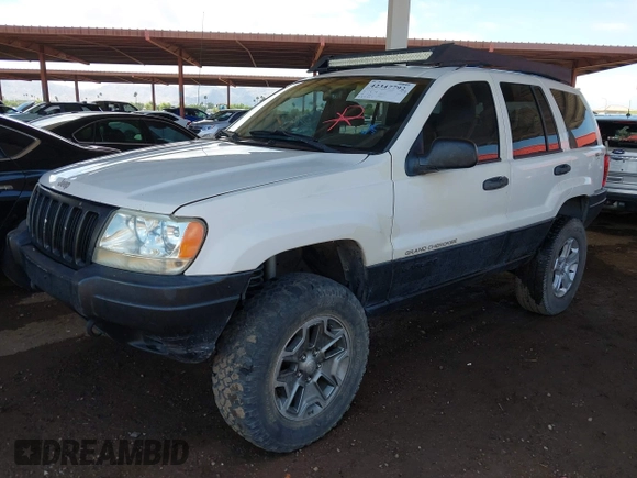 2000 Jeep Grand Cherokee Laredo z VIN 1J4GW48S4YC299149, wystawiony jako IAAI lot #42347792 z przebiegiem 229 007 mil mil oraz . Historia ofert i sprzedaży dostępna na DreamBid. Obrazek 2.