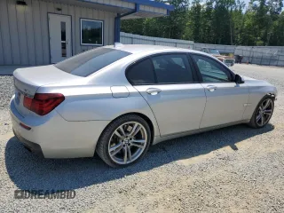 2013 BMW 7 Series 750i with VIN WBAYA8C58DC996865, listed as a Copart auction lot 61831294 with 151,238 mi miles and Salvage Title. Bid and sale history available at DreamBid. Image 3.