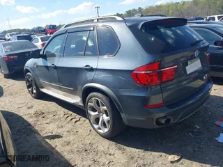 2011 BMW X5 35i with VIN 5UXZV4C58BL410570, listed as a IAAI auction lot 41886238 with 164,192 mi miles. Bid and sale history available at carsss.com. Image 3.