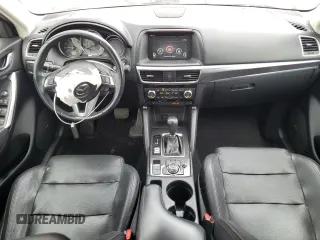 2016 Mazda CX-5 Grand Touring with VIN JM3KE4DY0G0664379, listed as a Copart auction lot 54659005 with 116,022 mi miles and Salvage Title. Bid and sale history available at DreamBid. Image 8.