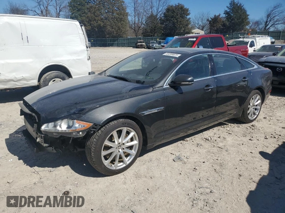 2013 Jaguar XJ Portfolio with VIN SAJWJ2GDXD8V45921, listed as a Copart auction lot 49289825 with 115,152 mi miles and Salvage title. Bid and sale history available at DreamBid. Image 1.