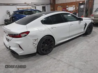2020 BMW M8 with VIN WBSGV0C06LCE47698, listed as a IAAI auction lot 41457199 with 50,772 mi miles. Bid and sale history available at carsss.com. Image 4.