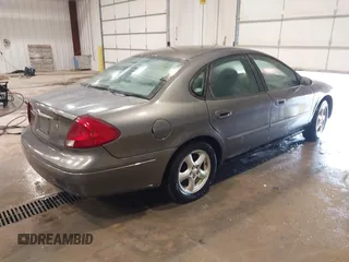 2003 Ford Taurus SE Standard z VIN 1FAFP53UX3G167579, wystawiony jako IAAI lot #42140606 z przebiegiem 178 147 mil mil oraz . Historia ofert i sprzedaży dostępna na DreamBid. Obrazek 4.