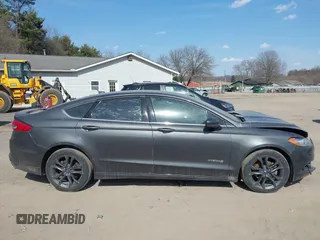 2018 Ford Fusion SE z VIN 3FA6P0LU6JR118226, wystawiony jako IAAI lot #41811406 z przebiegiem 165 352 mil mil oraz . Historia ofert i sprzedaży dostępna na DreamBid. Obrazek 14.