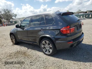 2012 BMW X5 35i with VIN 5UXZV4C54CL744502, listed as a Copart auction lot 57828115 with 161,597 mi miles and Clean title. Bid and sale history available at DreamBid. Image 2.