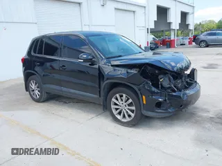 2014 Volkswagen Tiguan S z VIN WVGBV3AX8EW537304, wystawiony jako IAAI lot #42222348 z przebiegiem 162 364 mil mil oraz . Historia ofert i sprzedaży dostępna na DreamBid. Obrazek 1.