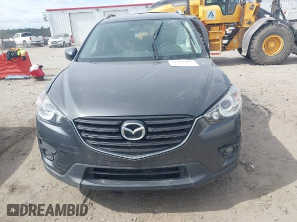 2016 Mazda CX-5 Grand Touring with VIN JM3KE4DY9G0845707, listed as a IAAI auction lot 41709685 with 96,351 mi miles. Bid and sale history available at carsss.com. Image 12.