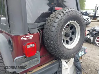 2004 Jeep Wrangler SE with VIN 1J4FA291X4P720783, listed as a IAAI auction lot 42446334 with 69,672 mi miles and . Bid and sale history available at DreamBid. Image 6.