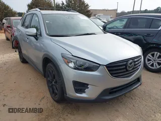 2016 Mazda CX-5 Grand Touring with VIN JM3KE4DY1G0616714, listed as a IAAI auction lot 41459781 with 90,763 mi miles. Bid and sale history available at carsss.com. Image 1.