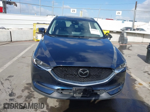2021 Mazda CX-5 Grand Touring with VIN JM3KFBDM6M1312573, listed as a IAAI auction lot 41936739 with Not Provided miles and . Bid and sale history available at DreamBid. Image 11.