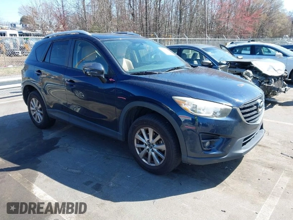 2016 Mazda CX-5 Touring with VIN JM3KE4CY0G0631786, listed as a IAAI auction lot 41761214 with 220,058 mi miles. Bid and sale history available at carsss.com. Image 1.