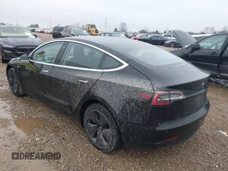 2018 Tesla Model 3 Long Range Battery with VIN 5YJ3E1EB1JF127289, listed as a IAAI auction lot 41484253 with 60,577 mi miles and . Bid and sale history available at DreamBid. Image 3.