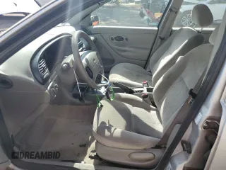 1998 Ford Contour LX with VIN 1FAFP66L2WK290948, listed as a Copart auction lot 56204295 with 76,307 mi miles and Salvage title. Bid and sale history available at DreamBid. Image 7.