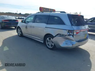 2012 Honda Odyssey Touring with VIN 5FNRL5H95CB063003, listed as a IAAI auction lot 41871975 with 179,332 mi miles and . Bid and sale history available at DreamBid. Image 3.